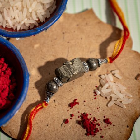 PYRITE TUMBLE RAKHI - Pyrite Tumble Stone.